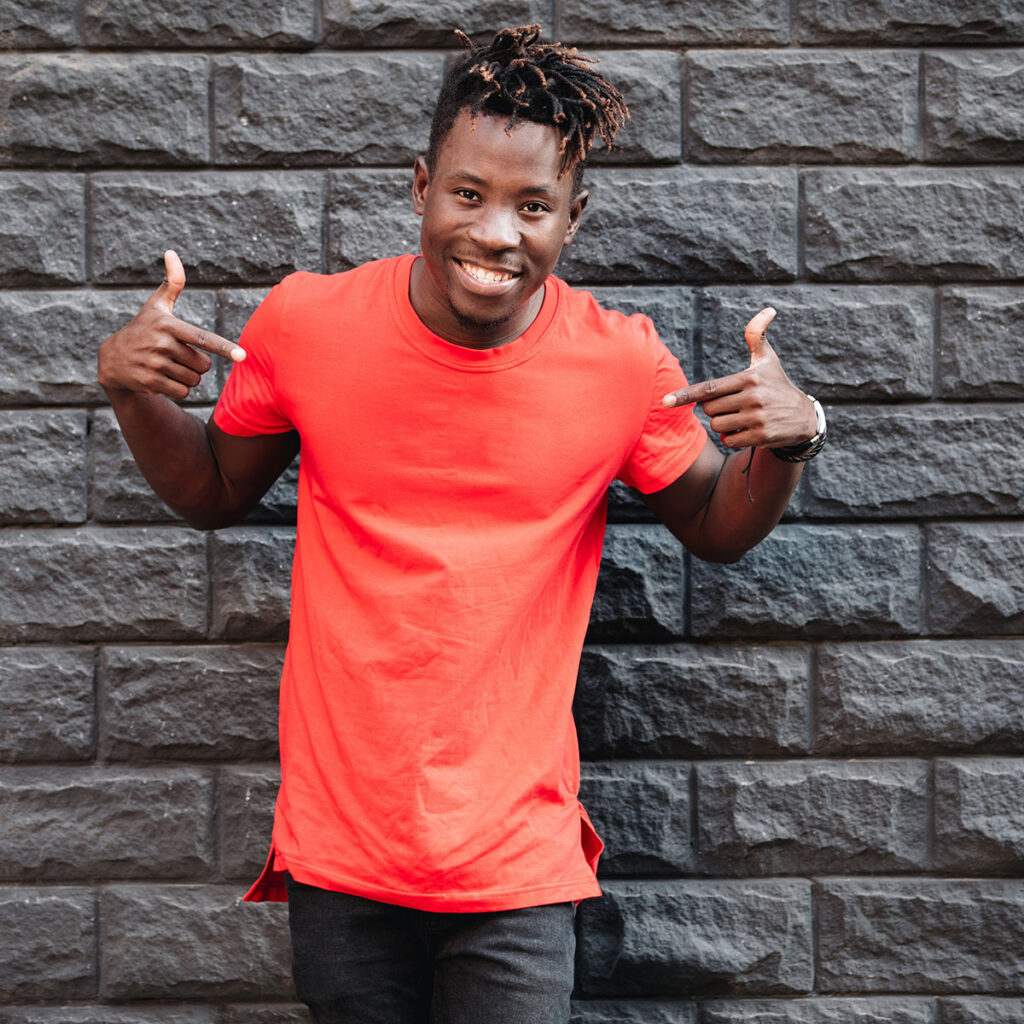 Mockup, african man model showing empty red tshirt